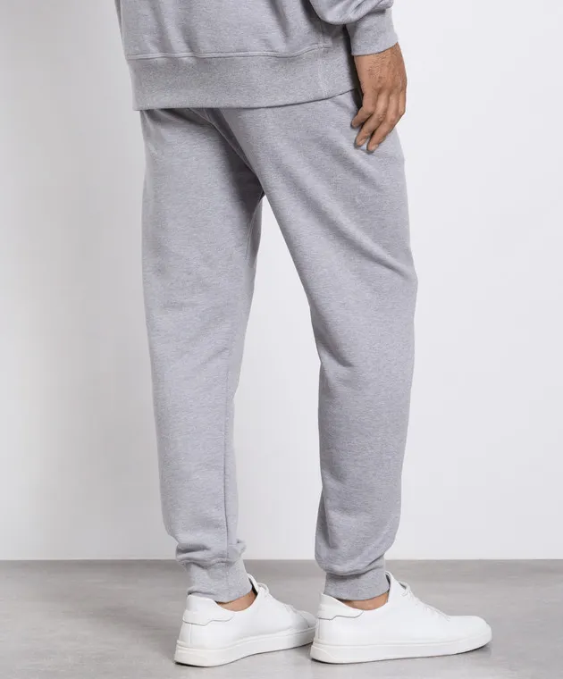 Alexander McQueen Gray joggers with graffiti logo print